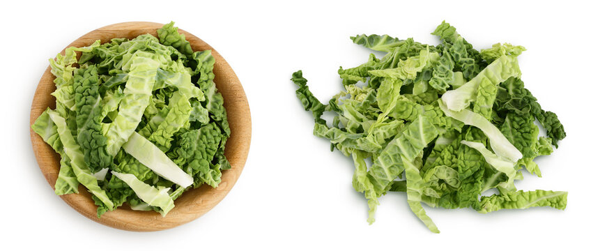 chopped savoy cabbage in wooden bowl isolated on white background with full depth of field. Top view. Flat lay