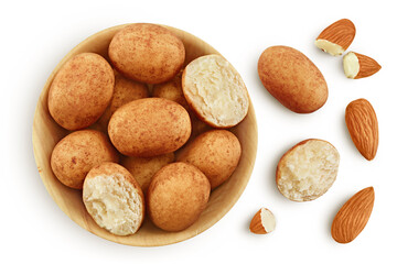 Marzipan balls or potatoes with almond in wooden bowl isolated on white background full depth of field. Top view. Flat lay