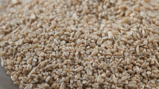 raw wheat groats rotate in a circle