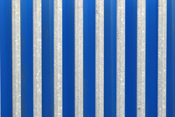 Unpainted Steel Security Fence seen against Blue Background 