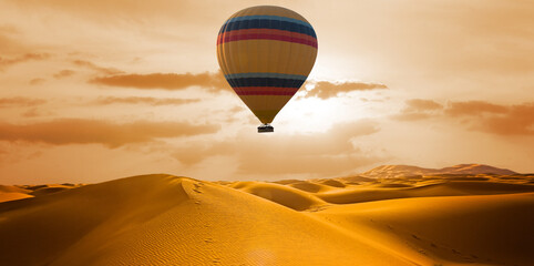 Desert and hot air balloon Landscape at Sunrise. Travel, inspiration, success, dream, flight concept