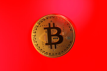 Bitcoin on the red background