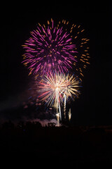 Fireworks of different colors with the black background