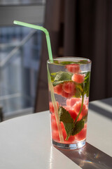 Watermelon smoothie with balls, water and mint. A refreshing detox drink.
