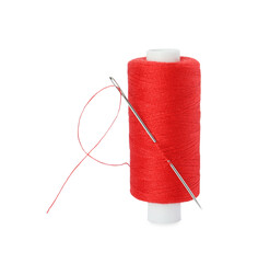 Spool of red sewing thread with needle isolated on white