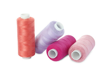 Many different colorful sewing threads on white background