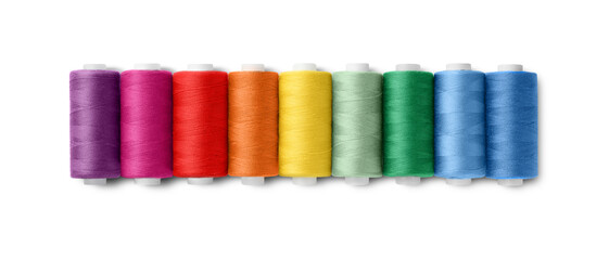 Set of different colorful sewing threads on white background, top view