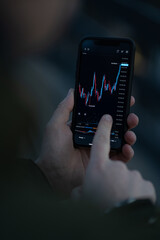 Businessman using mobile app for trading and investing online