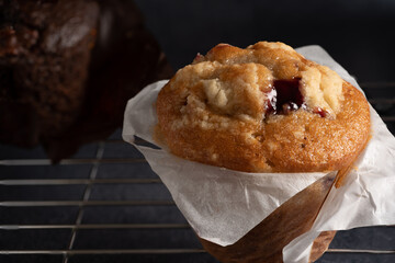 Freshly made blueberry muffin on a cooling rack