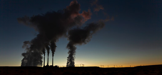 Dawn breaking near Industrial commercial power plant USA