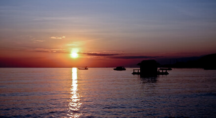 Obraz premium Sunrise with boat ship. West Bali, Indonesia