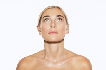 Young, beautiful 35 years old woman with well-kept skin isolated on white background. Spa, anti-aging treatment, face lifting and skin care concept