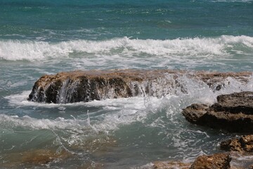 Italy, Salento: Foam of the rough sea.