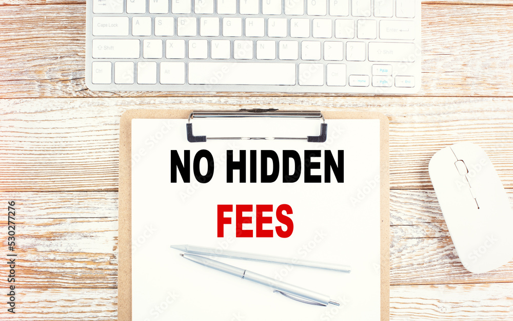 Poster no hidden fees text on a clipboard with keyboard on wooden background