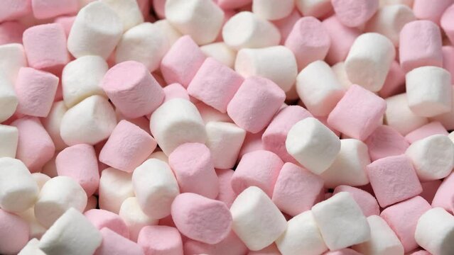 White and pink marshmallows rotating background video