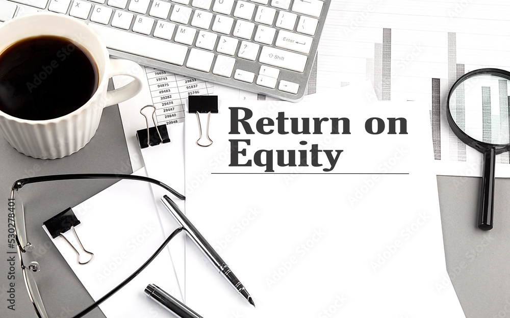Aufkleber return on equity text on a paper with magnifier, coffee and keyboard on grey background