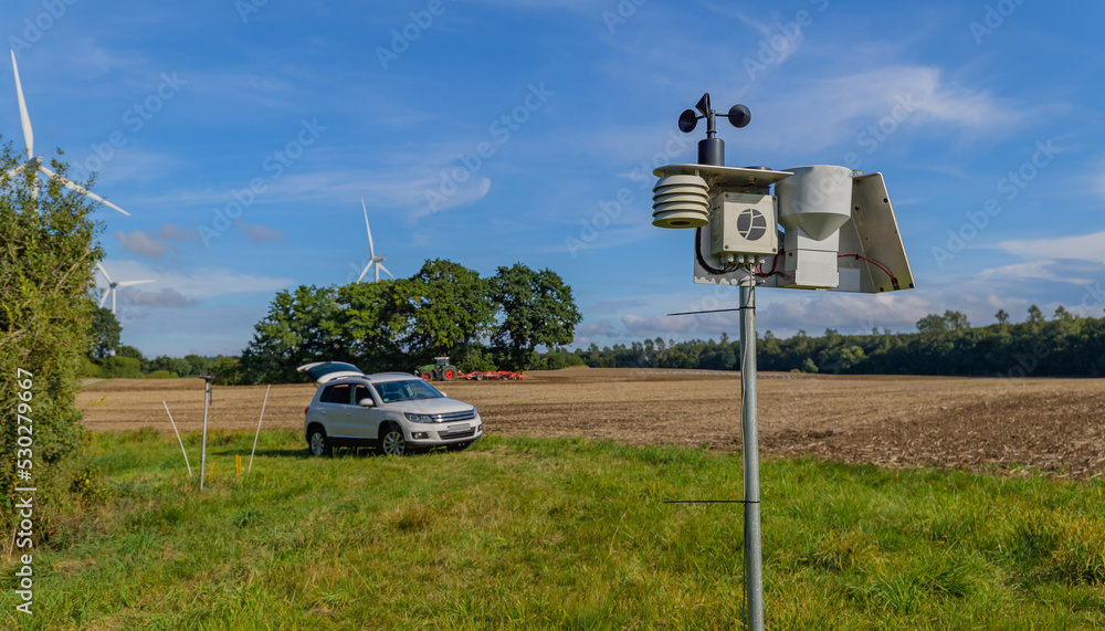 Wall mural Modern and digital agriculture with a weather station when the weather is nice.