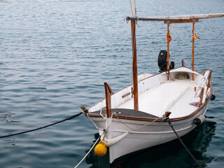Typical Menorcan boat anchored in the small port of Cales Fonts, Menorca.