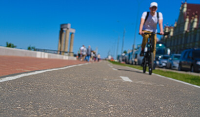 A cyclist on a bike path. Cycling on a clear day.