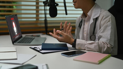 Cropped shot doctor in white coat giving medical advices or professional healthcare consultation...