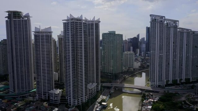 Pasig River and Rockwell Business Center in Makati, Metro Manila, Philippines. Drone Shot
