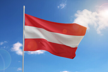 Fototapeta na wymiar Flag of Austria on blue sky. 3d illustration.