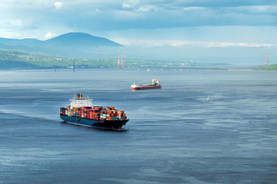 Container ships on St Lawrence river in Quebec, Canada