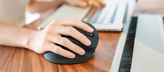 woman hand using computer ergonomic mouse, prevention wrist pain because working long time. De Quervain s tenosynovitis, Intersection Symptom, Carpal Tunnel Syndrome or Office syndrome concept