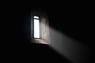 light falling through window in old church