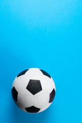 Fototapeta na wymiar Composition of football on blue background with copy space
