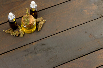 Fototapeta na wymiar Image of cbd oil in bottles on wooden background
