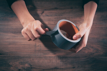woman holding construction tape in her hands