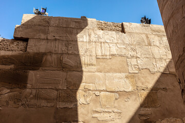 Different hieroglyphs on the walls and columns in the Karnak temple. Karnak temple is the largest...