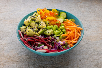 Close up of hawaiian poke bowl on grey background