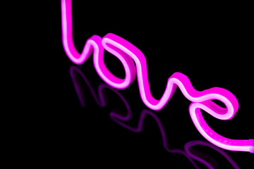 Image of vibrant neon love text formed with pink glow sticks over black background and copy space