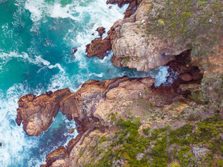 Fototapeta na wymiar High angle view of sea waves and sea shore with rocky cliff shore