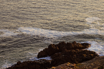 Fototapeta na wymiar Landscape of sea waves and sea shore with rocks and stones