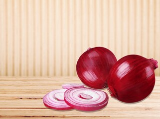 Delicious onions vegetables on the desk background