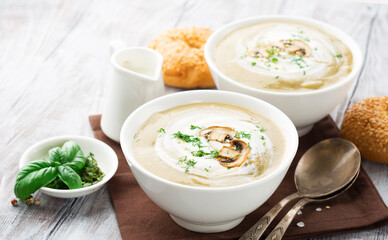 Homemade Mushroom Cream Soup on White Wooden Table.