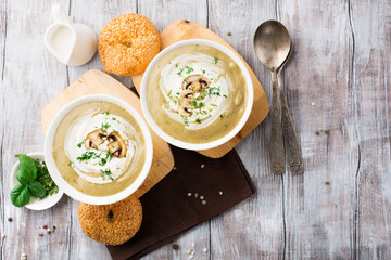 Homemade Mushroom Cream Soup on White Wooden Table.