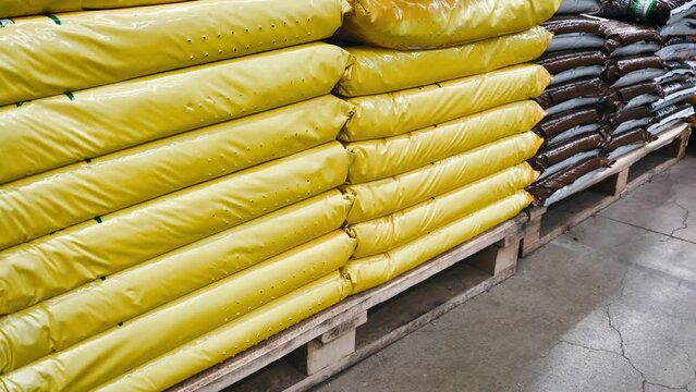 fertilizer packs bags for plants wholesale farm garden vegetable garden. High quality 4k footage. packing industrial chemistry