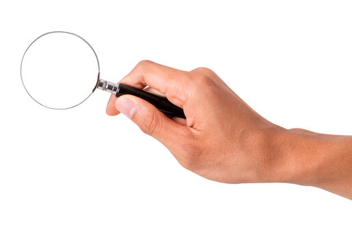 Hand holding a magnifying glass. Isolated on a White Background.