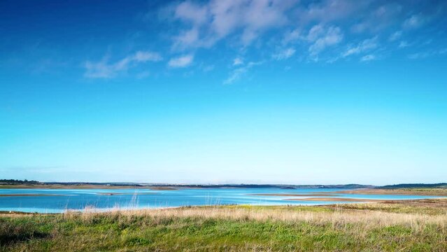 View of Alqueva Dam artificial lake at Luz village, Alentejo tourist destination region, district of Evora, Portugal Europe.