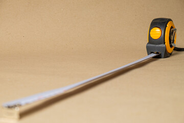 Cartridge meter. Yellow measuring tape isolated on craft paper background. With
 space for text