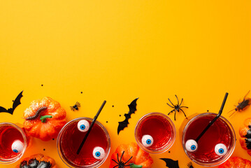 Halloween party concept. Top view photo of glasses with drink floating eyes punch straws pumpkins...