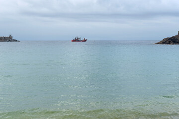 Fishing boat leaves to fish from the Port of Ondarroa. Biscay