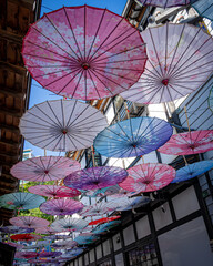 Umbrella sky of Japanese umbrellas at Otaru Shussezen Plaza, Otaru City, Hokkaido