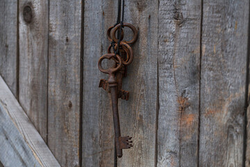 old vintage keys on the background of old door boards