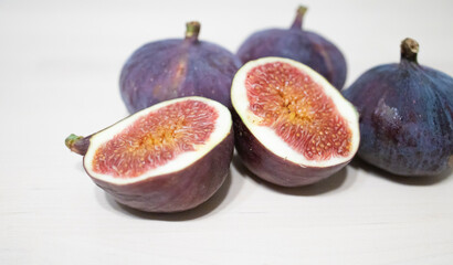 figs on a light table surface. Exotic fruits, vitamins, problems with the supply of fruit to Russia