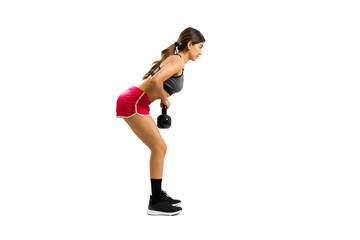 Sporty active woman working out with a kettlebell weight